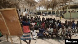 Children gather at a makeshift school at the IDPs Abagena camp in Benue, Nigeria, April 11, 2018.