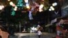 A woman walks along the once-popular Pub Street in Siem Reap, Cambodia, May 9, 2020. (Phorn Bopha/VOA Khmer) 