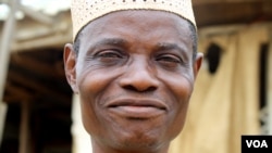 John Odewale, who heads the Mpape resident’s association, says the town was marked for destruction last summer by hundreds of armed men. (Heather Murdock for VOA)