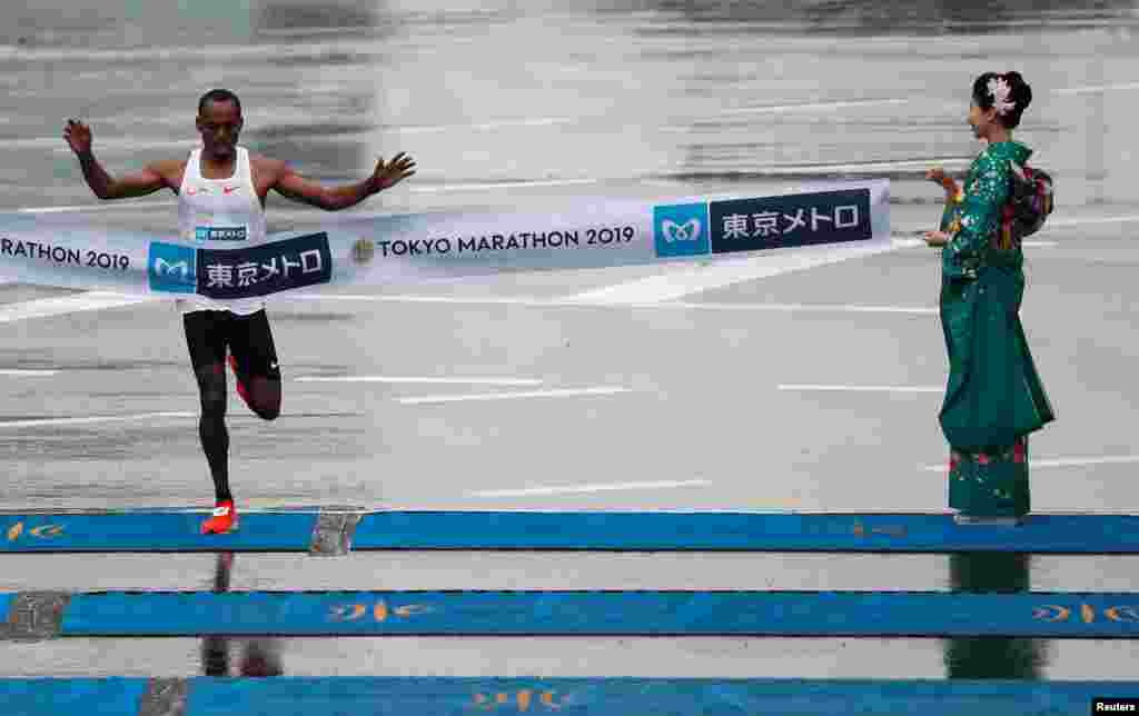 Birhanu Legese of Ethiopia crosses the finish line at the Tokyo Marathon in Japan.