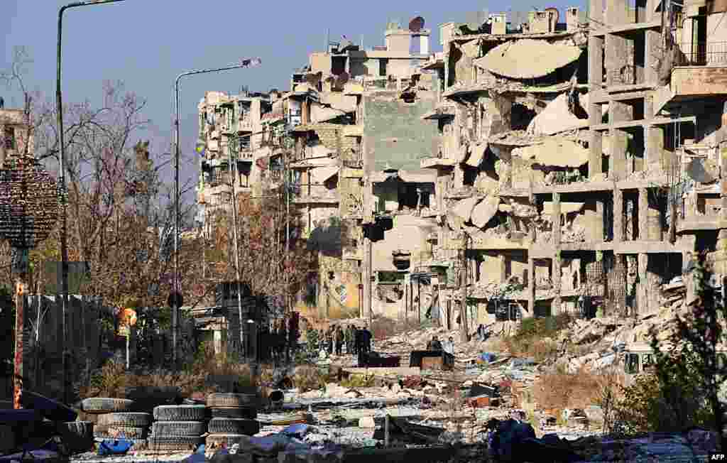 Destruction is seen in Aleppo's Bustan al-Basha neighborhood during Syrian pro-government forces assault to retake the entire northern city from rebel fighters.