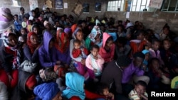 FILE - Eritrean refugees wait to get registered on arrival at the Indabaguna refugee reception and screening center in Tigrai region near the Eritrean border in Ethiopia, Feb. 9, 2016.