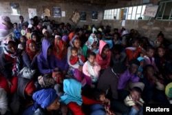 FILE - Eritrean refugees wait to get registered on arrival at the Indabaguna refugee reception and screening center in Tigrai region near the Eritrean border in Ethiopia, Feb. 9, 2016.