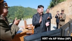 This picture said to be of North Korean leader Kim Jong Un was made from video of a news bulletin aired by North Korea's KRT on Tuesday, July 4, 2017. North Korea claimed to have successfully launched an intercontinental ballistic missile. 