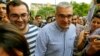 Ilgar Mammadov, center, the leader of the opposition REAL movement, walks with supporters after being released from a prison in Shaki, Azerbaijan, Aug. 13, 2018. 