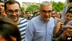 Ilgar Mammadov, center, the leader of the opposition REAL movement, walks with supporters after being released from a prison in Shaki, Azerbaijan, Aug. 13, 2018. 