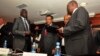 Nhial Deng Nhial (left) of South Sudan's negotiating team and Taban Deng Gai (right), negotiator for Riek Machar's rebel group, exchanged signed cessation of hostilities agreements in Addis Ababa one year ago, but South Sudan is still mired in conflict.