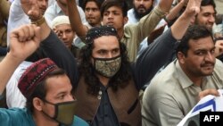 FILE - Activists of Pashtun Protection Movement (PTM) protest against the arrest of their activists and leaders, in Karachi, Feb. 10, 2019. 