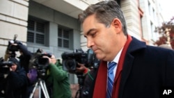 CNN's Jim Acosta walks into federal court in Washington, Nov. 14, 2018, to attend a hearing on a legal challenge against President Donald Trump's administration.