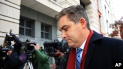 CNN's Jim Acosta walks into federal court in Washington, Nov. 14, 2018, to attend a hearing on a legal challenge against President Donald Trump's administration.