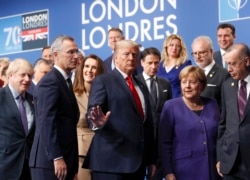 NATO Secretary General Jens Stoltenberg, U.S. President Donald Trump, Germany's Chancellor Angela Merkel, Turkey's President Tayyip Erdogan and other NATO Alliance leaders leave the stage after family photo during the annual NATO heads of government summit at the Grove Hotel in Watford, Britain December 4, 2019.