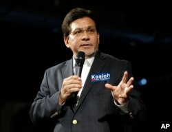 FILE - Former U.S. Attorney General Alberto Gonzales speaks at a rally in Nashville, Tennessee, Feb. 27, 2016.