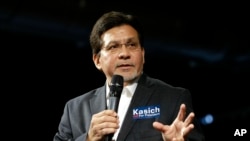 Former U.S. Attorney General Alberto Gonzales introduces Republican presidential candidate Ohio Gov. John Kasich at a rally, Feb. 27, 2016, in Nashville, Tennessee.