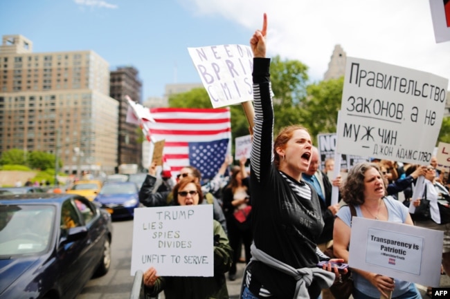 Demonstrators take part in an anti-Trump "March for Truth" rally at Foley Square on June 3, 2017 in New York City.