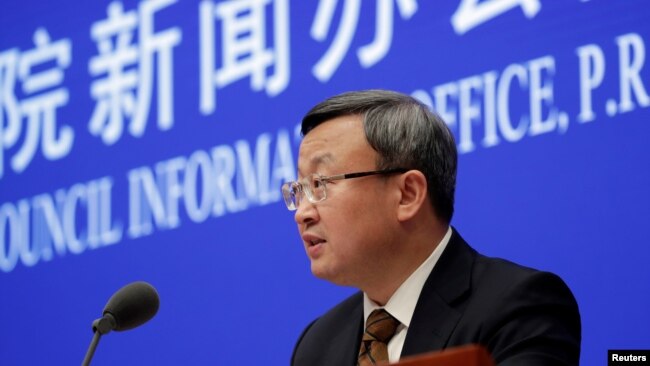 中国商务部副部长王受文在北京的国务院新闻办召开的记者会上宣布美中已就第一阶段贸易协议文本达成一致。（2019年12月13日）