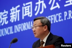 中国商务部副部长王受文在北京召开的记者会上宣布美中已就第一阶段贸易协议文本达成一致。（2019年12月13日）