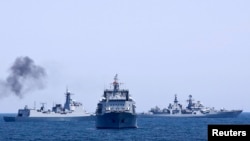 FILE - Chinese and Russian naval vessels are seen during a 2014 joint naval exercise outside Shanghai on the East China Sea.