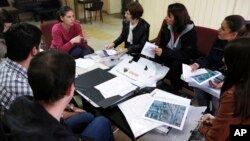 FILE - Bosnian population census officials brief pollsters before they head to work in Sarajevo, Oct. 1, 2013.