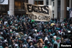 FILE - Philadelphia Eagles fans line the Super Bowl LII championship parade route outside City Hall in Philadelphia, Feb 8, 2018. (B. Streicher/USA Today)