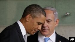 US President Barack Obama, left, listens to Israeli Prime Minister Benjamin Netanyahu during their visit to the Children's Memorial at the Yad Vashem Holocaust memorial in Jerusalem, March 22, 2013.