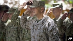 Gen. John Allen, center, the top U.S. commander in Afghanistan, salutes before he observes Memorial Day May 28, 2012.