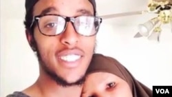 Abdi Mohamud Nur, shown in this undated photo with his mother, right, is one of two men facing terrorism charges announced Tuesday. He is believed to be fighting in Syria. 