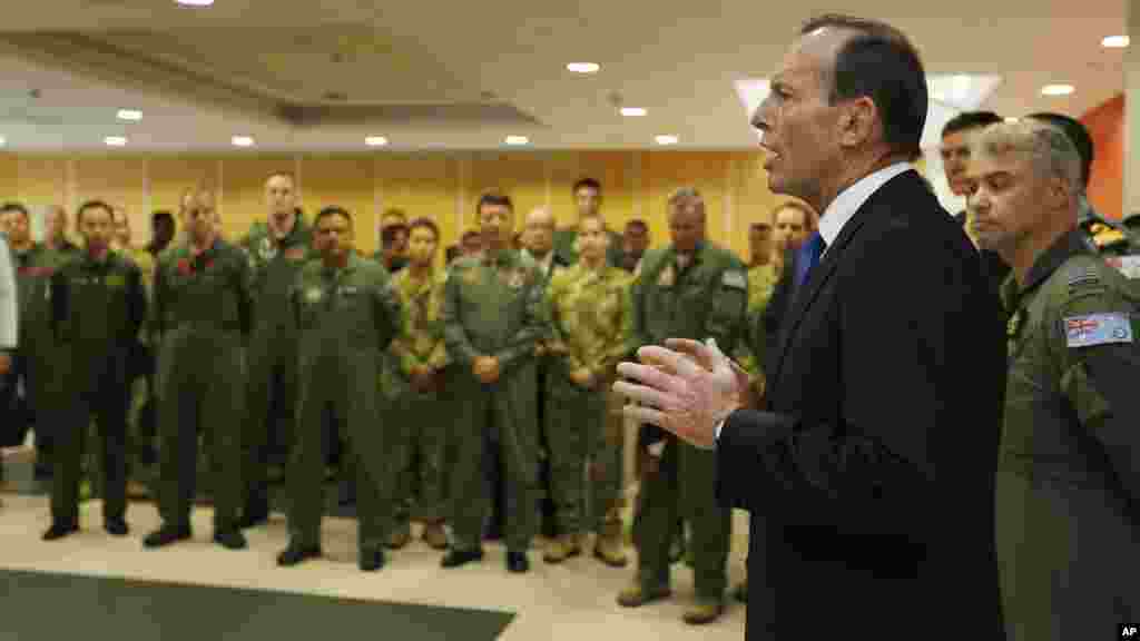 Australian Prime Minister Tony Abbott addresses the international forces currently based in Perth searching for Flight MH370 during his visit to RAAF Base Pearce, March 31, 2014.