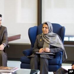 Afghan Labor and Social Affairs Minister Amina Afzali in talks with U.S. Labor Secretary Hilda Solis in Washington, May 10, 2011