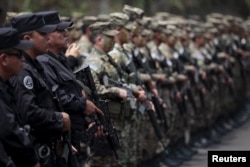 Members of the Territorial Intervention force, a combined army-police unit, participate in a presentation ceremony prior to their deployment to deal with gang violence in violent areas, at La Campanera Neighborhood in Soyapango, El Salvador, April 26, 2016.