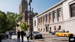 FILE - The New-York Historical Society, at right, is next to an entrance to the city's Central Park.
