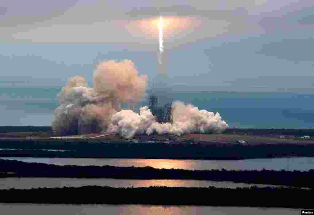 A SpaceX Falcon 9 rocket disappears into clouds after it lifted off on a supply mission to the International Space Station from historic launch pad 39A at the Kennedy Space Center in Cape Canaveral, Florida.