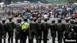 Opposition supporters clash with Venezuelan National Guards during a rally to demand a referendum to remove President Nicolas Maduro in Caracas, Venezuela, May 18, 2016.