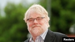 U.S. actor Philip Seymour Hoffman poses on the red carpet during a screening for the movie "The master" at the 69th Venice Film Festival in Venice, Sept. 1, 2012. 