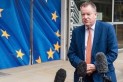 FILE - Then-Britain's chief Brexit negotiator David Frost gives a media statement at EU headquarters in Brussels, Belgium, Nov. 19, 2021.