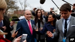 White House chief economic adviser Larry Kudlow talks with reporters outside the White House, April 4, 2018, in Washington.