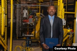 Julius Wakam with his Controls Technician certificate at the Aug. 8, 2018, graduation ceremony at Macomb Community College’s M-TEC facility in Warren, Michigan.