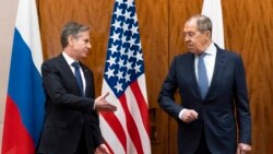 U.S. Secretary of State Antony Blinken, left, greets Russian Foreign Minister Sergey Lavrov before their meeting, in Geneva, Switzerland, Jan. 21, 2022.