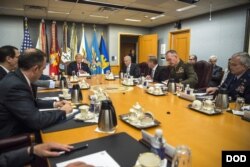 FILE - President Donald Trump speaks to Defense Secretary Jim Mattis and members of the National Security Council during a meeting at the Pentagon, July 20, 2017.