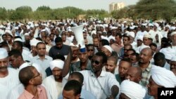 Family members and friends gather for the funeral of Salah Mudathir, 28, killed the day before in clashes following protests in the Sudanese capital Khartoum, Sept. 28, 2013. 