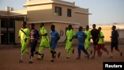 FILE - Former members of the militant group al-Shabab are held inside a prison in Garowe, Puntland state, in northeastern Somalia, Dec. 14, 2016. 