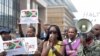 FILE - Singer Khadja Nin (C) takes part in a protest against Burundi President Pierre Nkurunziza and his bid for a third term, in Brussels, Belgium, May 23, 2015. 