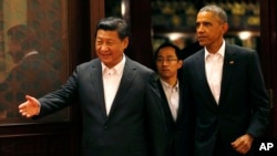 Chinese President Xi Jinping and U.S. President Barack at APEC gatheringTuesday in Beijing. 