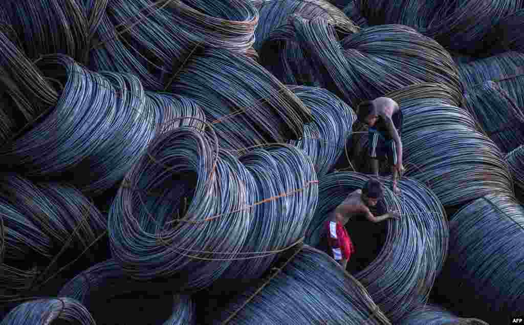 Children look for metal scraps at a pier in Manila, the Philippines.