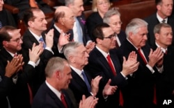 Members of President Donald Trump's Cabinet applaud him as he delivers his State of the Union address to a joint session of the U.S. Congress on Capitol Hill in Washington, Jan. 30, 2018.