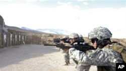 Unidentified U.S. Marines refine their skills while participating in the Special Forces Basic Combat Course at the Army deport in Hawthorne, Nev., Sept. 29, 2008.
