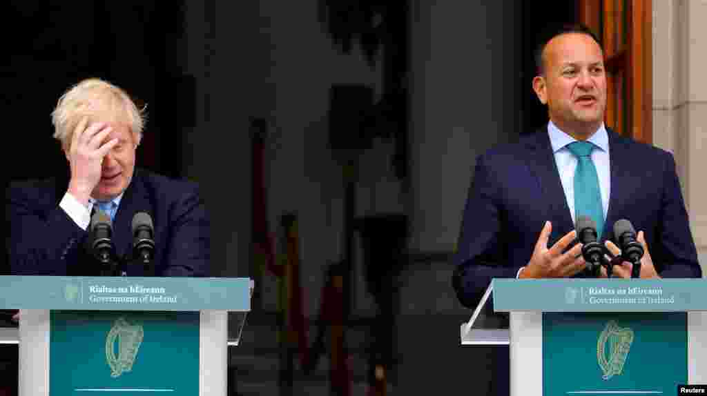 Britain&#39;s Prime Minister Boris Johnson reacts as Ireland&#39;s Prime Minister (Taoiseach) Leo Varadkar speaks in Dublin, Ireland.