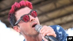 Joe Jonas, of the musical group DNCE, performs during the LeSutra Model Volleyball in Miami Beach, Florida, Feb. 21, 2016. 