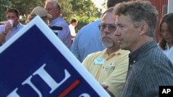 Tea Party candidate Rand Paul talks to attendees of the 'Red, White and Blue Picnic' in Owensboro, Kentucky