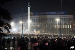 Riot police block protesters in the center of Almaty, Kazakhstan, Jan. 5, 2022.