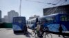 FILR - People ride their bicycles past parked city trolleys in Pyongyang, North Korea, on Monday, Oct. 12, 2015.